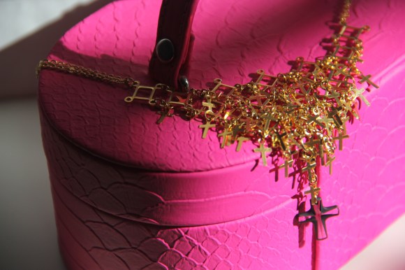 This necklace has almost 100 gold crosses attached individually. Took me ages! The clear cross is also detachable (JJ's idea!).